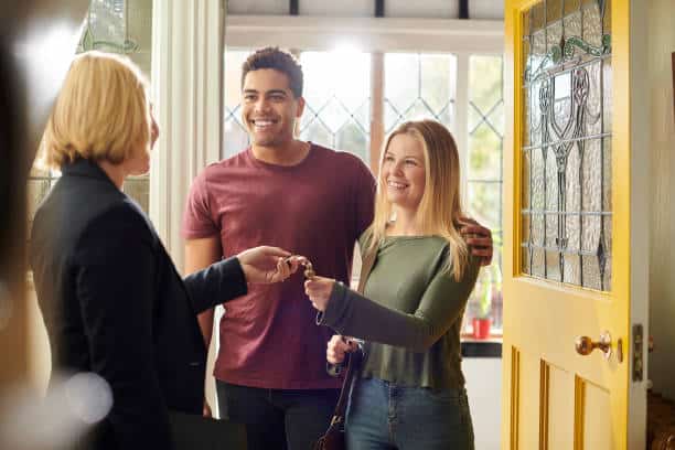 house hunting couple get the keys